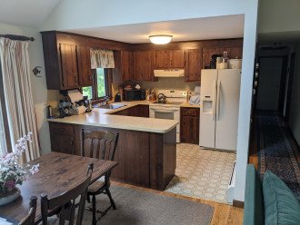 Custom kitchen accessed from dining room or from main hall