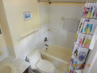 Master Bath Kohler fixtures tub and shower, tile floor, tile wall surround