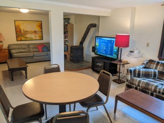 Lower-Level sitting area, large TV, game table