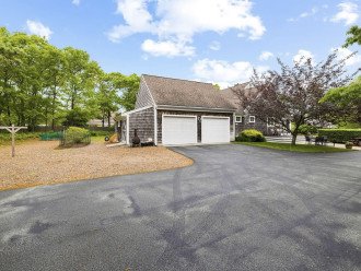 Driveway with garage available and room for three cars across