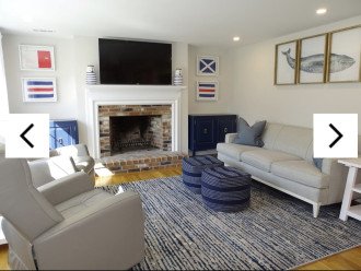 Bright living room with new furniture, Smart TV and hardwood floors