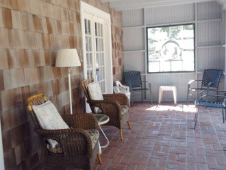 Screened porch, relax by day or evening