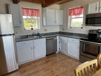 Recently Renovated Kitchen with New Appliances, Diswasher and Oceanfront Dining.
