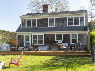 Spacious deck with BBQ and plenty seating for outdoor dining and relaxation