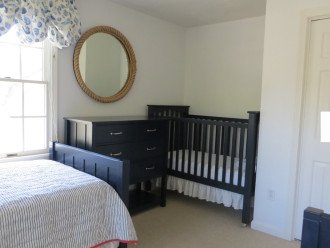 Two Twin beds and Pottery Barn crib in back BR