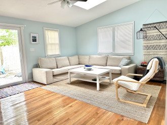 Bright living room with plenty of comfortable seating.