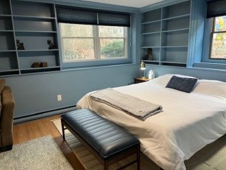 King bed with bookcases on first floor bedroom