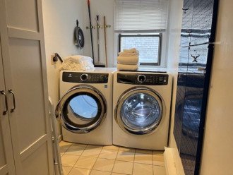 Full sized washer and dryer in laundry room