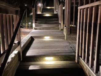 Well lit staircase leading to condo entrance